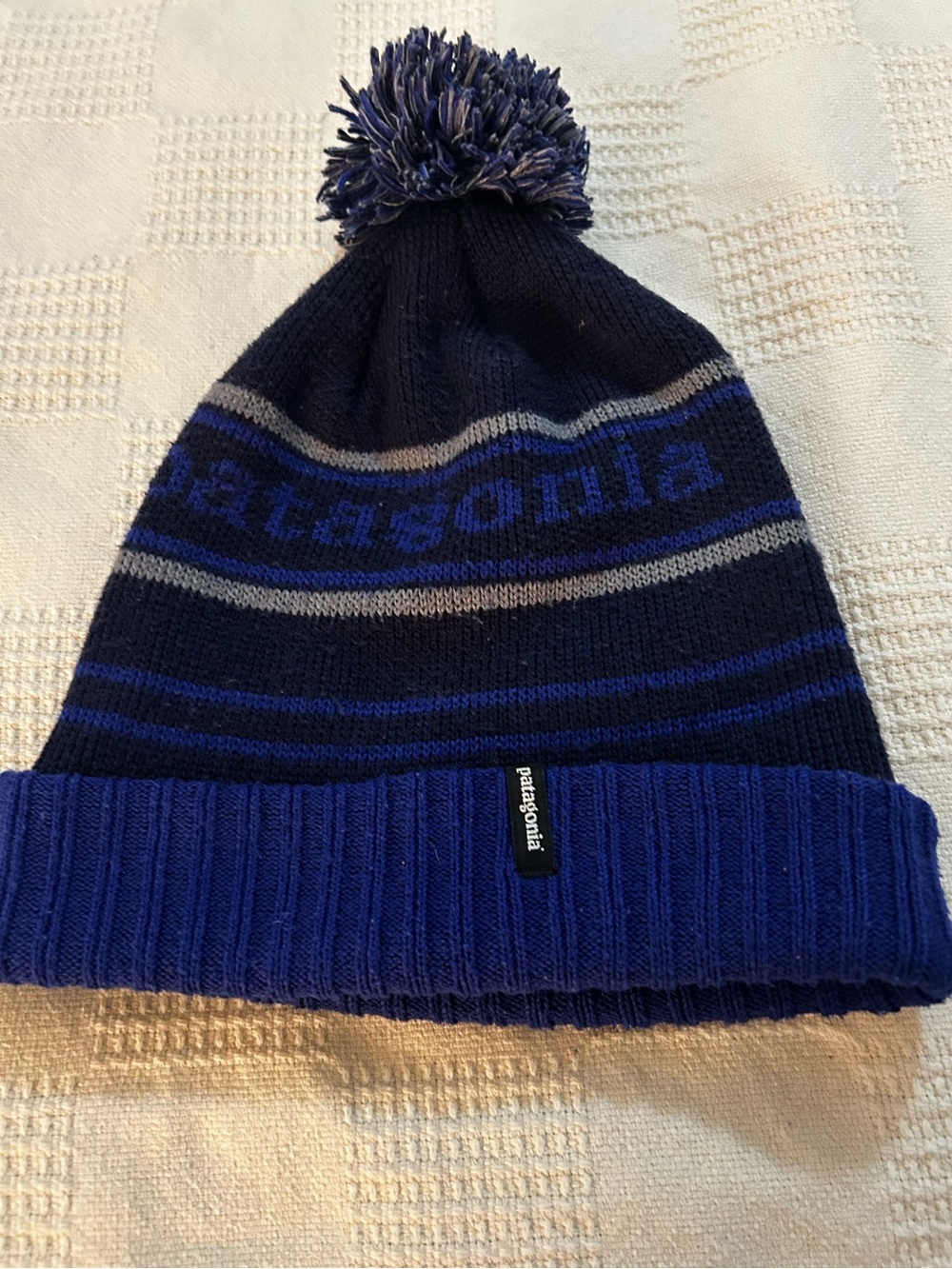 Patagonia Powder Town Beanie in a blue and navy striped park stripe pattern